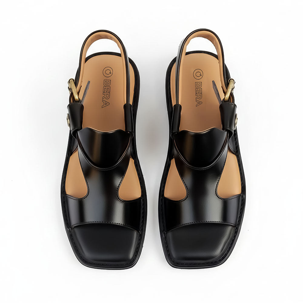 Black Panjedar chappals for men showing the front view and traditional leather design