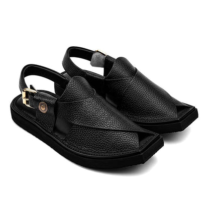 black Dot Khan Chappal pair shown from a three-quarter front view with textured leather straps and buckle closures