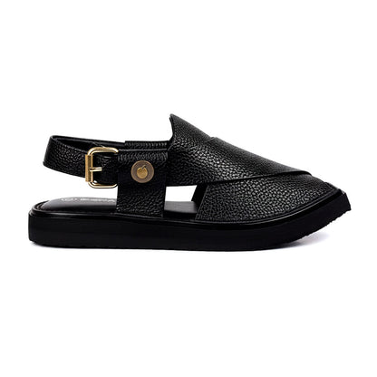 black Dot Khan Chappal shown from the side with textured leather straps, gold buckle and thick black sole