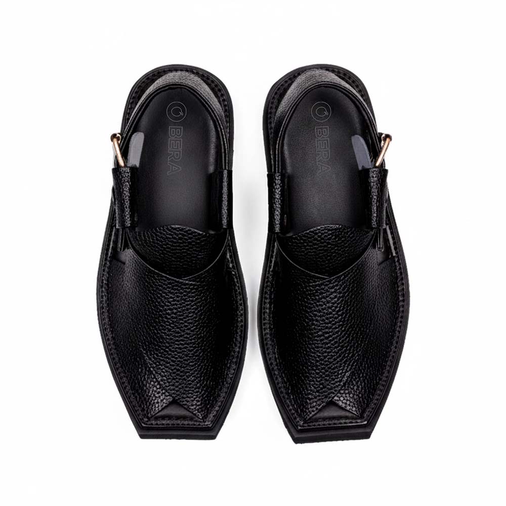 black Dot Khan Chappal pair shown from above with textured leather uppers, pointed toes and side buckle straps