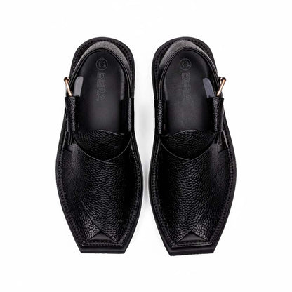 black Dot Khan Chappal pair shown from above with textured leather uppers, pointed toes and side buckle straps