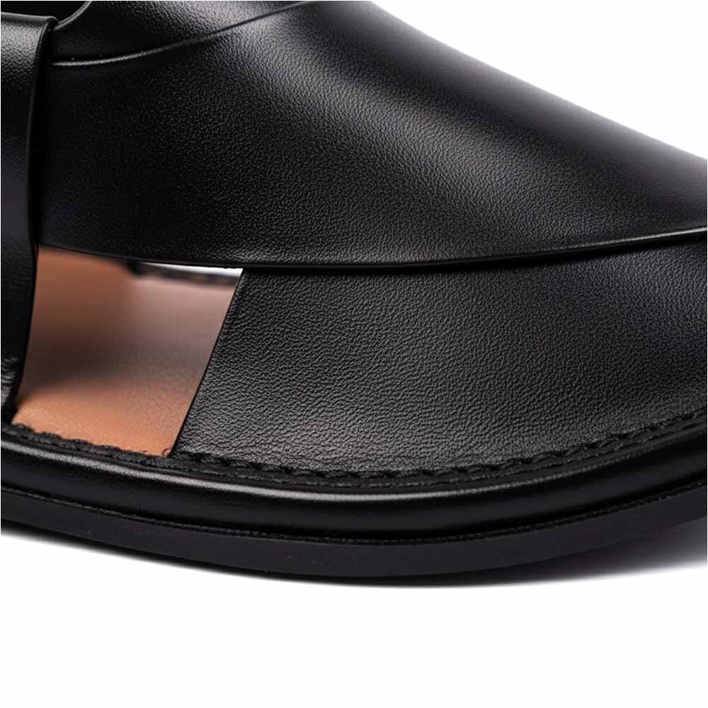 close-up of black Peshawari Kheri leather upper showing layered straps, stitching and black sole