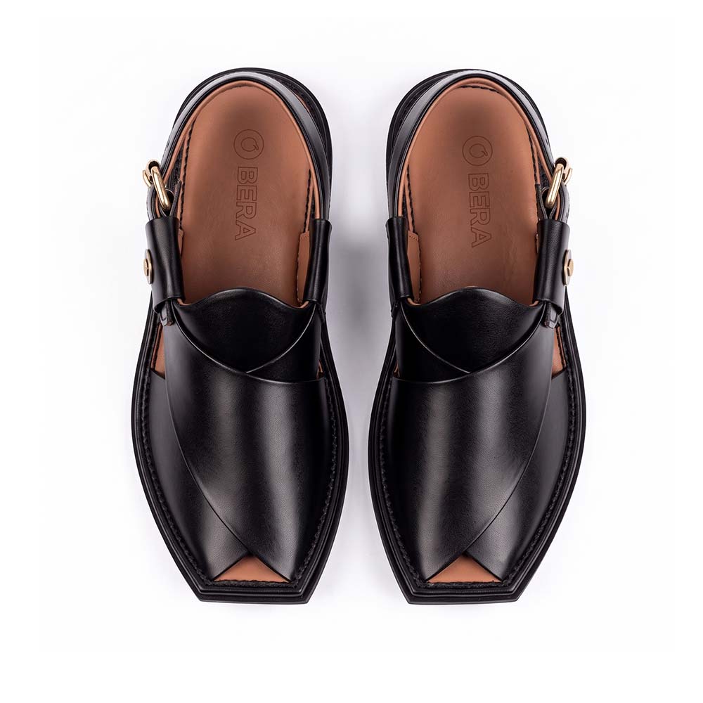 black Peshawari Kheri pair shown from the top with layered leather straps and brown insoles