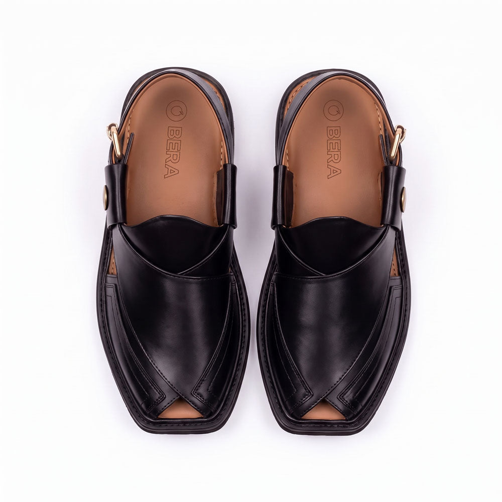 black Taki Chappal pair shown from the top with layered leather straps and tan branded insoles