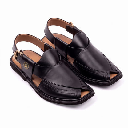 black Taki leather chappal pair shown from a three-quarter front view with closed leather uppers and back straps