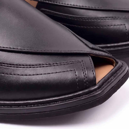close-up of black Taki Chappal showing smooth leather panels, detailed stitching and layered black sole