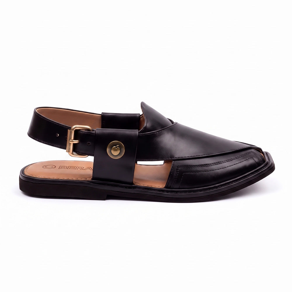 black Taki Chappal shown from the side with a closed pointed front, leather buckle strap and layered sole