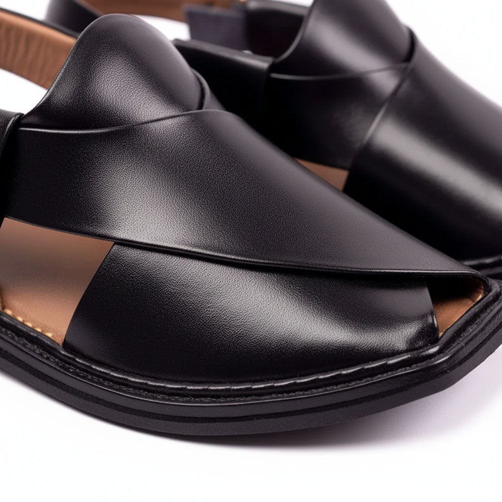 close-up of a black traditional Peshawari Chappal showing its smooth leather upper and layered black sole