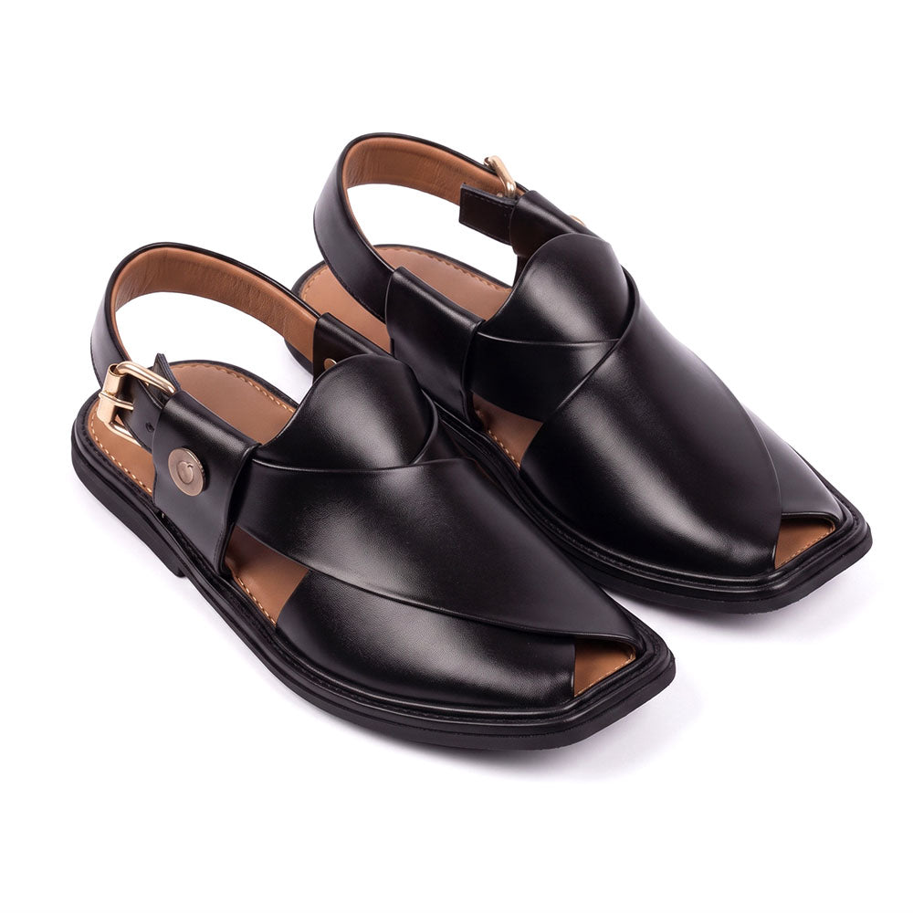 pair of black traditional Peshawari Chappals shown from a three-quarter view with overlapping leather straps 