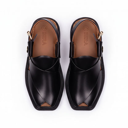 Black traditional Peshawari Chappal shown from the top with overlapping leather straps and a branded insole