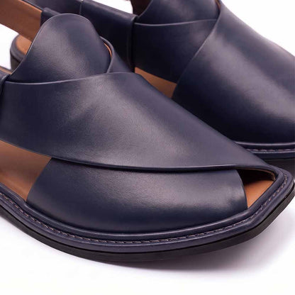 close-up of dark blue Charsadda Chappal showing overlapping leather straps and stitched sol