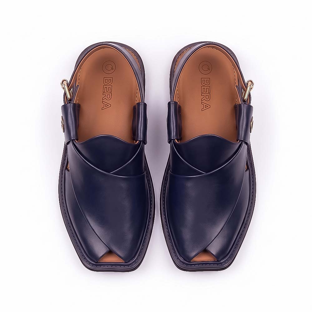  blue Peshawari Chappal pair shown from above with overlapping leather straps and tan branded insoles