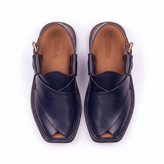  blue Peshawari Chappal pair shown from above with overlapping leather straps and tan branded insoles