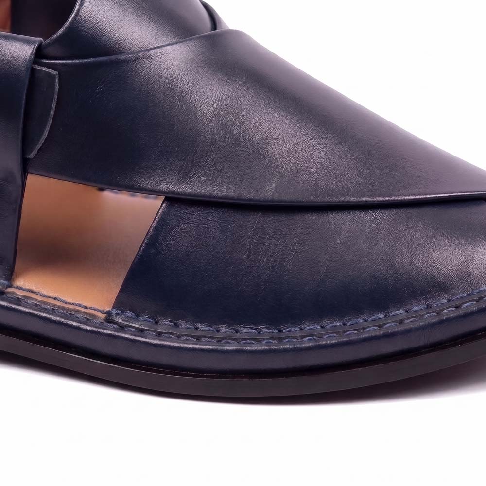 close-up of dark blue Peshawari Kheri showing the smooth leather upper, layered design and detailed stitching