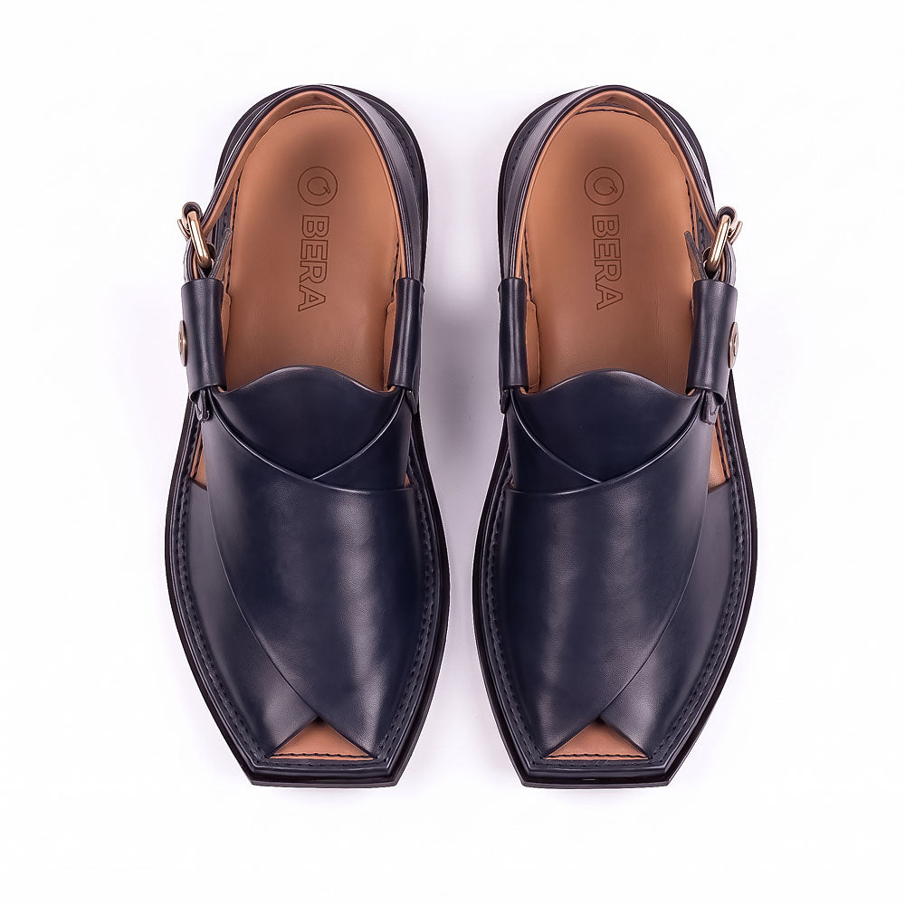 dark blue Peshawari Kheri pair shown from the top with crossed leather straps and branded insoles