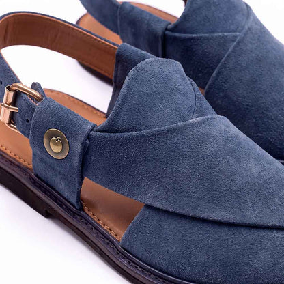 close-up of blue suede Charsadda Chappal showing layered straps, brass button detail and adjustable buckle