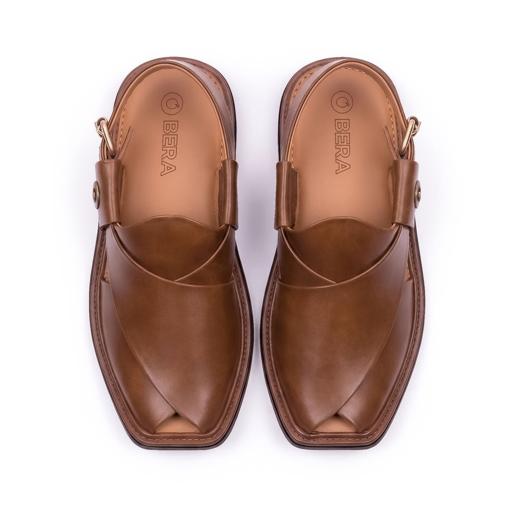 brown traditional Peshawari Kheri pair shown from above with smooth leather crossed straps and branded insoles