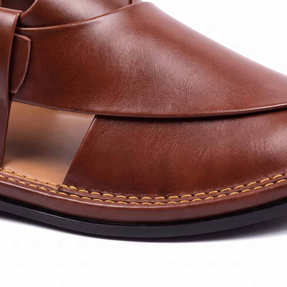 close-up of burgundy T-shape Peshawari Kheri showing smooth leather panels and detailed yellow stitching along the sole
