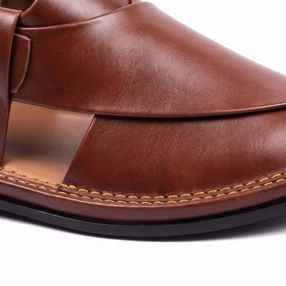 close-up of burgundy T-shape Peshawari Kheri showing smooth leather panels and detailed yellow stitching along the sole