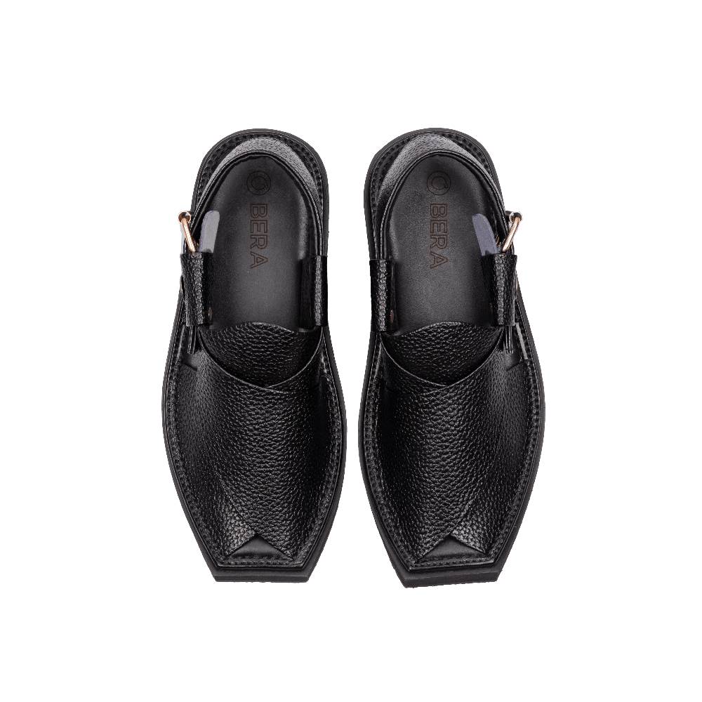 Crafted from dotted leather, these Khan Chappals showcase a strap design with a gold-toned buckle in the center. The sandals rest upon black soles, and a subtle "BERA" logo graces the upper left corner of the image.