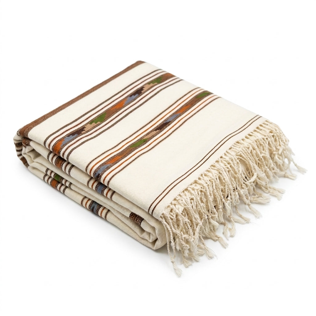 Neatly folded men's off-white khaddar wool shawl featuring multi-lined ethnic geometric borders and fringe tassels