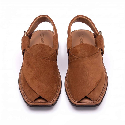 A top-down view of a pair of tan suede leather Peshawari Chappals featuring crossed upper panels, detailed perimeter stitching, and embossed BERA branding on the insoles against a white background.  