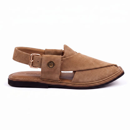 camel suede Peshawari Chappal shown from the side with crossed leather straps, buckle closure and stitched sole