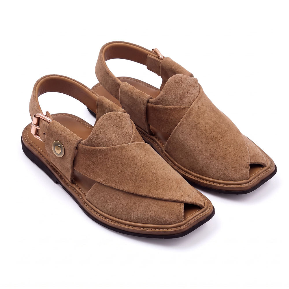 camel suede Peshawari Chappal pair shown from a three-quarter front view with crossed leather straps and adjustable heel buckles